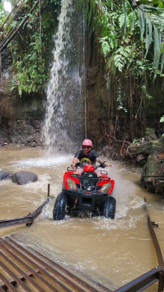 ATV Through Waterfall